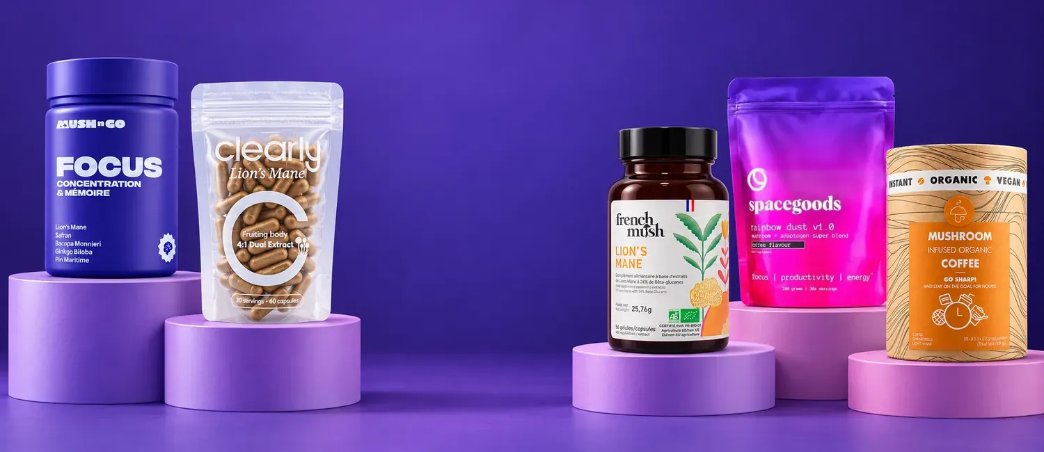 Mush N Go Focus, Clearly Lion's Mane, French Mush The Lion's Mane Bio, Spacegoods Rainbow Dust és Mushroom Cups Go Sharp dobogókon, lila háttér előtt